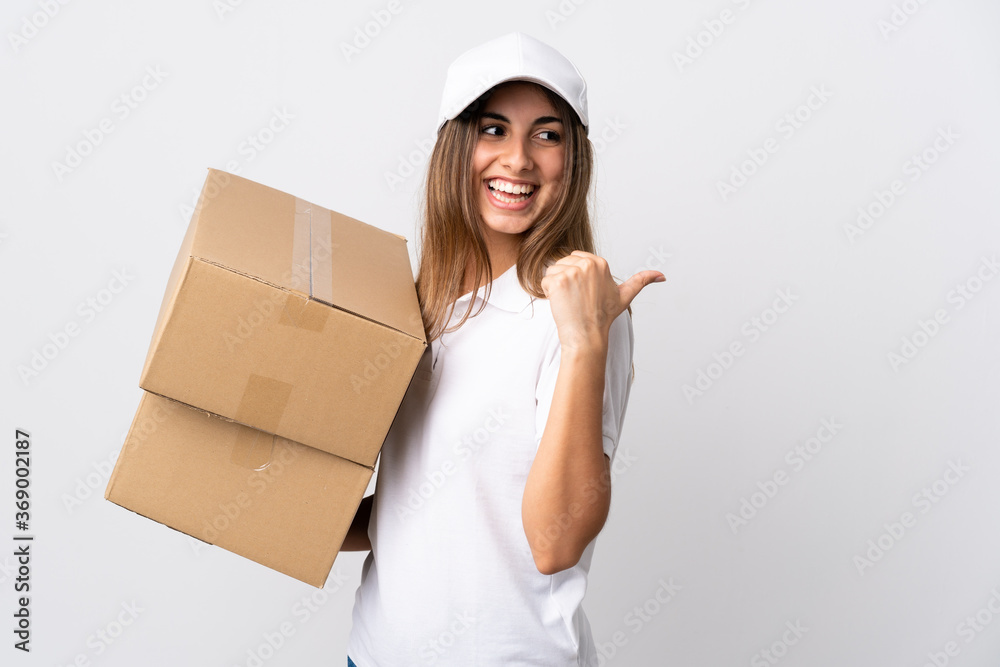 Young delivery woman over isolated white background pointing to the side to present a product Young delivery woman over isolated white background pointing to the side to present a product