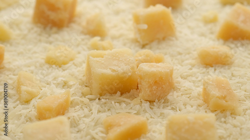hard cheese parmesan grated and pieces close up