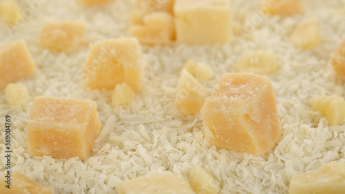 parmesan cheese grated and pieces close up