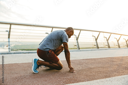 Young african man jogger exercising outdoors