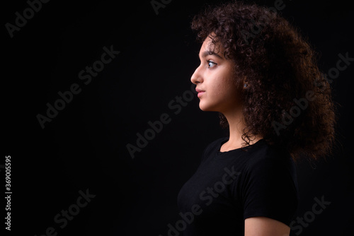 Portrait of young beautiful Persian teenage girl with curly hair