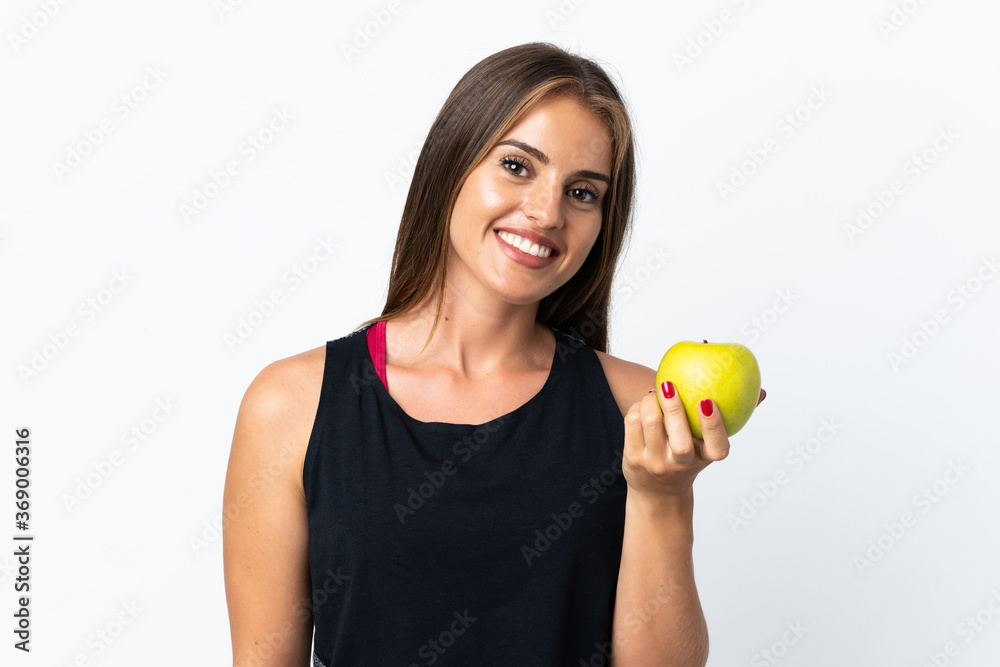Young Uruguayan woman isolated on white background with an apple Young Uruguayan woman isolated on white background with an apple