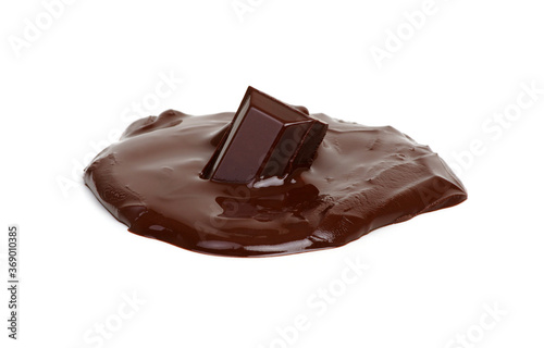Melting piece of dark chocolate bar on white