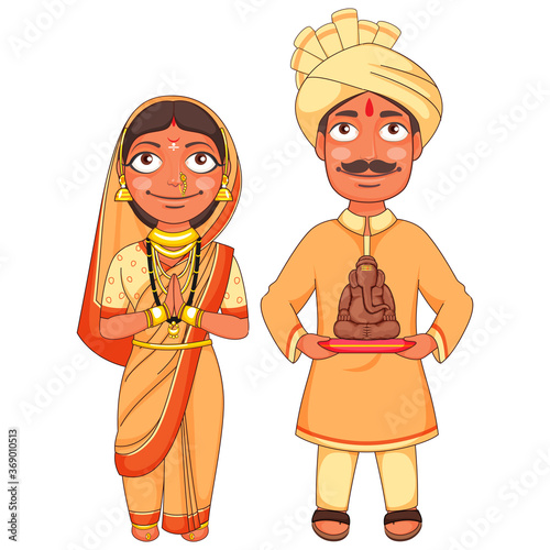 Maharashtrian Couple in Traditional Dress Holding A Small Statue Of Lord Ganesha. photo