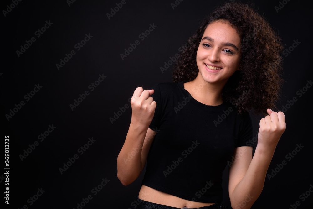 Portrait of young beautiful Persian teenage girl with curly hair Portrait of young beautiful Persian teenage girl with curly hair