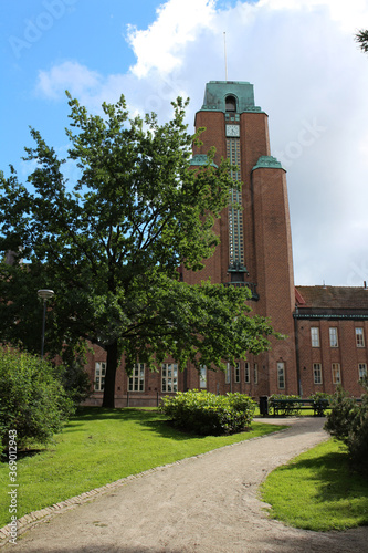 A Park with paths and a large tree in front of the town hall. Lahti. Finland.