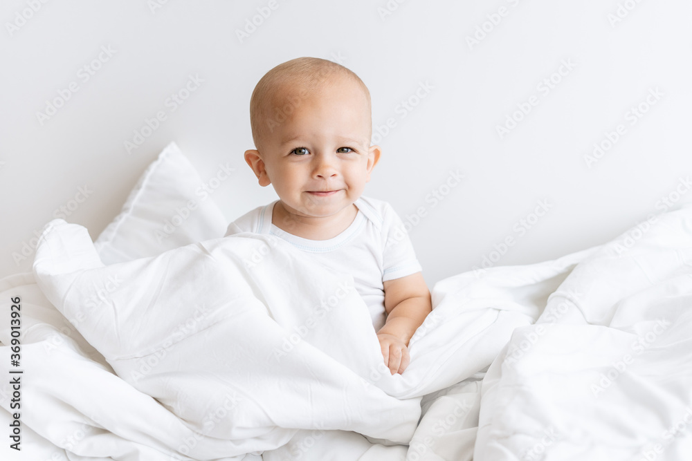 child boy in white blanket