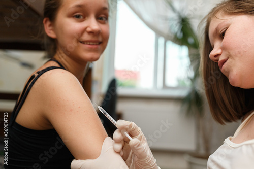 Injection of insulin in arm. Treating Diabetes.