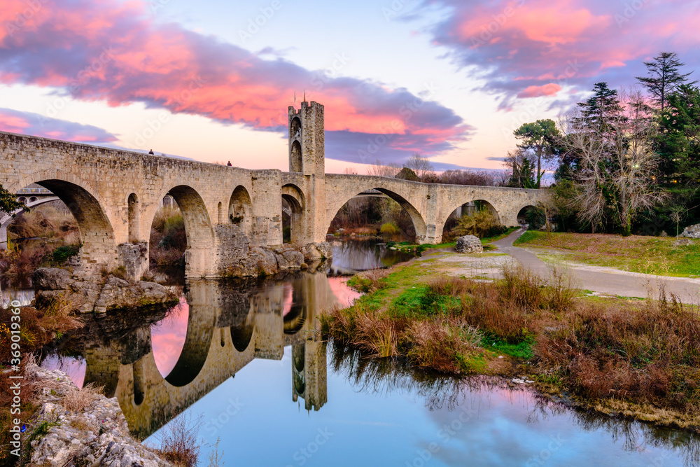 Sunset at the Medieval bridge of the Besalu (Catalonia, Spain)