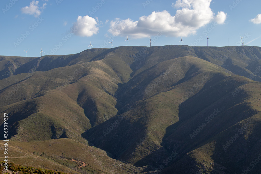 Beautiful mountain landscape, in Serra da Freita, with a wind farm on top of the mountain, located in Arouca Geopark, Portugal
