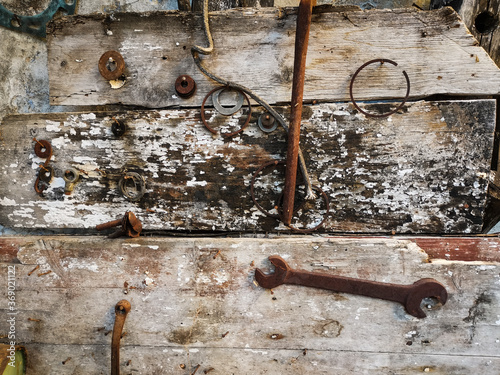 rusty metal tools on wooden background