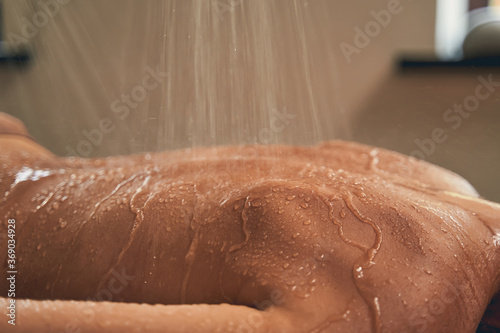 Portrait of woman skin caring in the hydrotherapy of spa photo