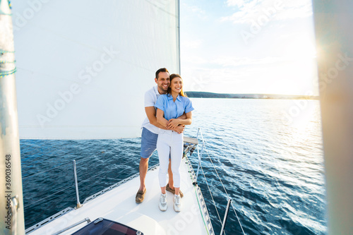 Couple Hugging On Yacht Spending Honeymoon Sailing Across The Sea © Prostock-studio