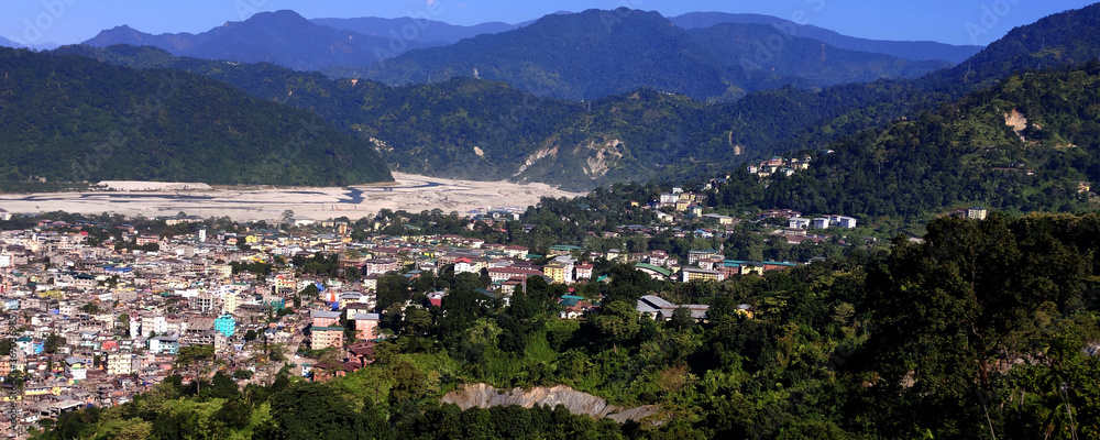 Naklejka premium settlement of Himalayan foot hill and river Torsha in bhutan.