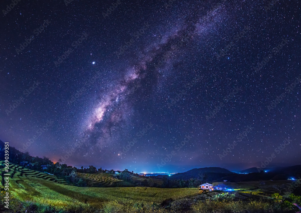 The Milky Way galaxy on the rice field on the mountain.Long exposure photograph, with grain.Image contain certain grain or noise and soft focus.