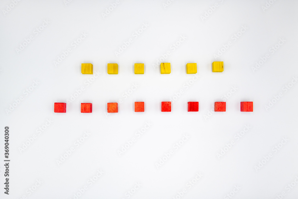 Yellow and red wooden cubes isolated on white background Yellow and red wooden cubes isolated on white background