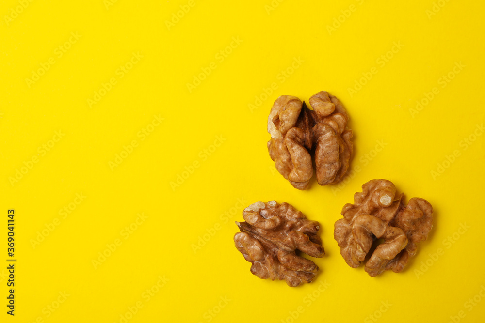 Tasty walnut on yellow background. Vitamin food Tasty walnut on yellow background. Vitamin food