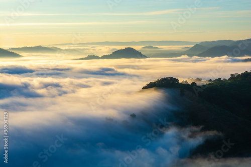 Beautiful landscape in the mountains at sunrise with mist and fog at mekong River Thai-Laos border Nong Khai province,Thailand. (selective focus and white balance shifting applied)