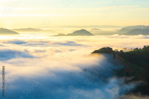 Beautiful landscape in the mountains at sunrise with mist and fog at mekong River Thai-Laos border Nong Khai province,Thailand. (selective focus and white balance shifting applied) © serra715