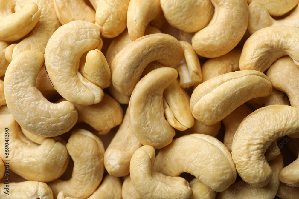 Tasty cashew nuts on whole background. Vitamin food Tasty cashew nuts on whole background. Vitamin food