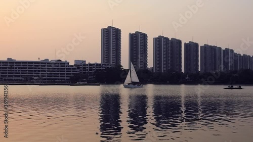 Scenery of Sunset lake against building office. cityscape and natural water lake photography. photo