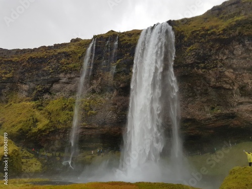 Waterfall in Iceland. Seljalandsfoss waterfall in Iceland in cloudy weather. Picture was taken on 13th of October 2019.