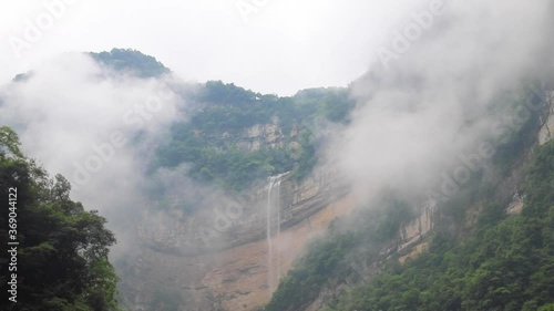 Water fall in Three Gorges Bamboo Sea Ecology Scenic Spot, Maopingzhen, Zigui, Yichang, Hubei, China in a foggy day photo