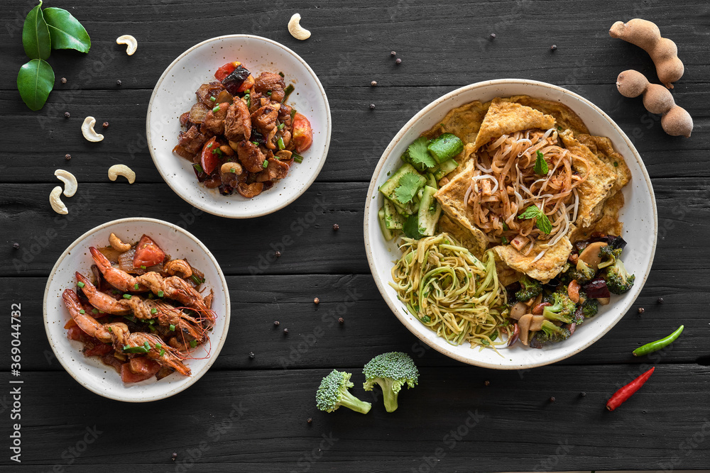 Shrimp Pad Thai, Thai Food, Thailand's dishes on a black wood background