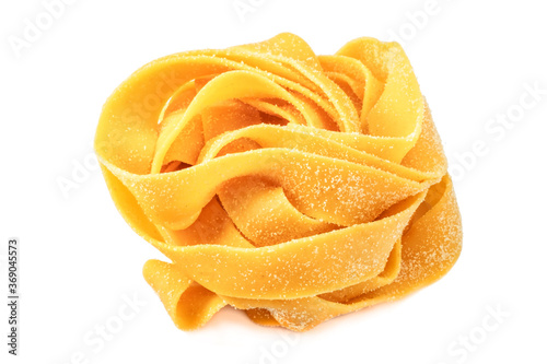 Photos Classic uncooked  tagliatelle or papardelle pasta isolated on a white background