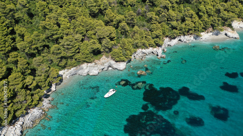 Aerial drone photo of breathtaking secluded turquoise beaches of Ftelia and Megalo Pefko in island of Skopelos, Sporades, Greece