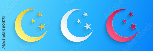 Paper cut Moon and stars icon isolated on blue background. Paper art style. Vector. © mingirov
