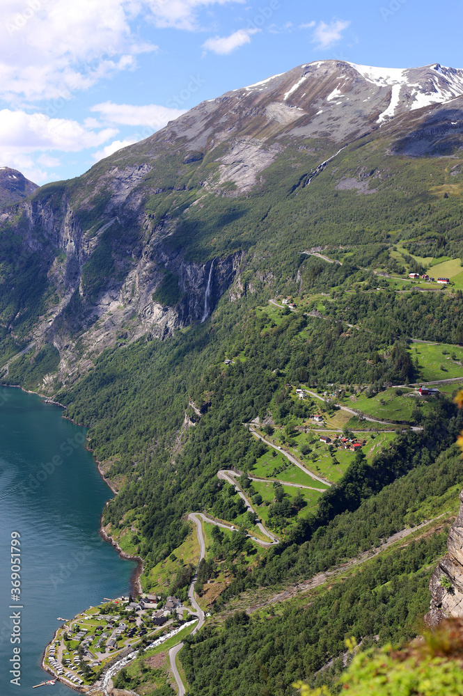 Mountain serpentine on the green slope of the Geiranger Fjord. Norway. Travels.