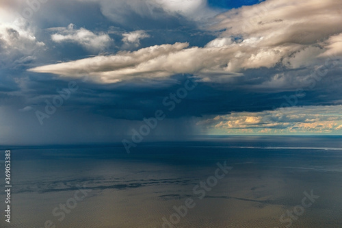 aerial view over the cloudy sky and horizon
