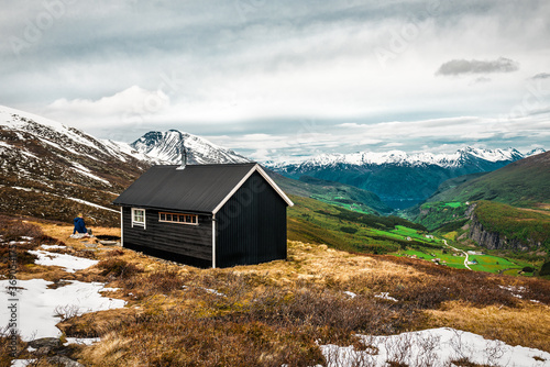 Tableau sur toile black wooden cabin in Norway mountains