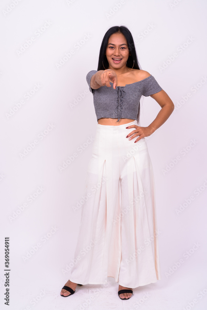 Portrait of happy young beautiful Asian woman with braces Portrait of happy young beautiful Asian woman with braces
