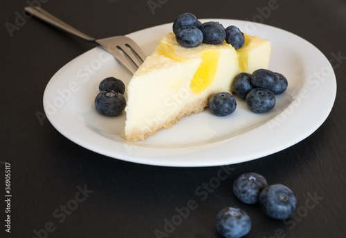 Lemon cheescake with blueberries on the plate