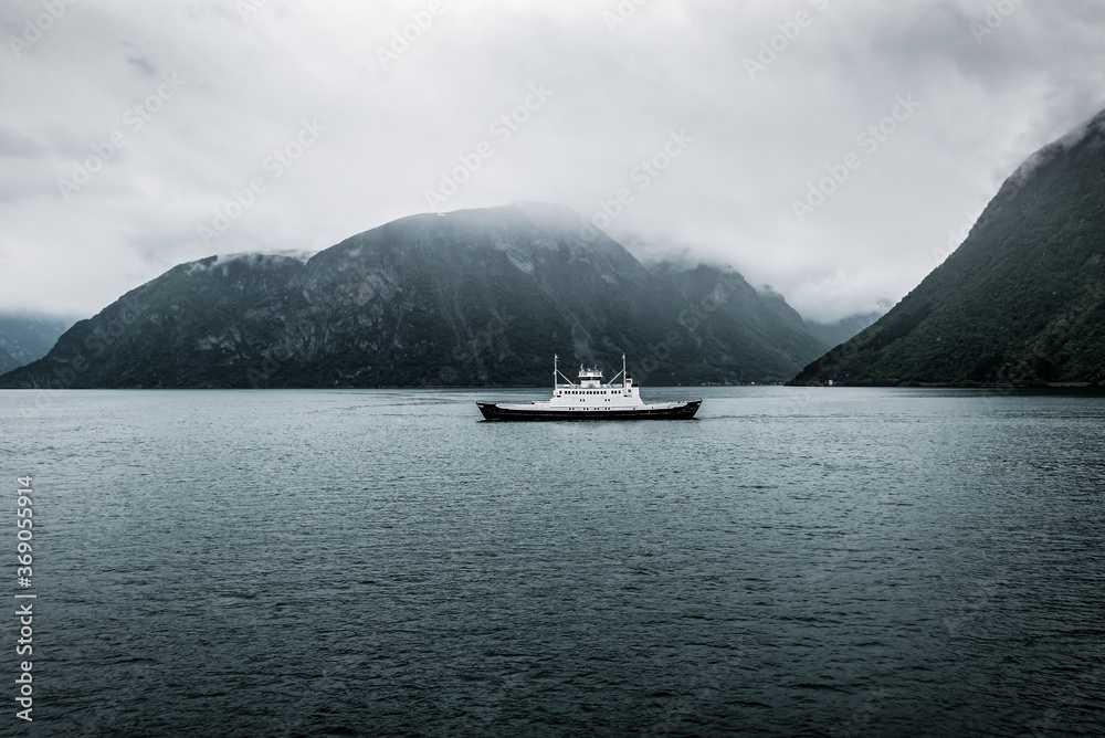 ferry boat floats in the fjord