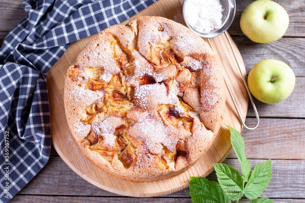 Apple pie, sponge cake, Charlotte with apples on a wooden table. Rustic style. Top view Apple pie, sponge cake, Charlotte with apples on a wooden table. Rustic style. Top view