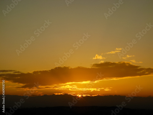 The grand sun which lights up cloud and it which are symbolic