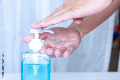 4K Close-up Hand man using hand sanitizer gel . Coronavirus hand sanitizerr gel for clean hands hygiene corona virus . Man using alcohol gel clean hand. Covid-19 concept.