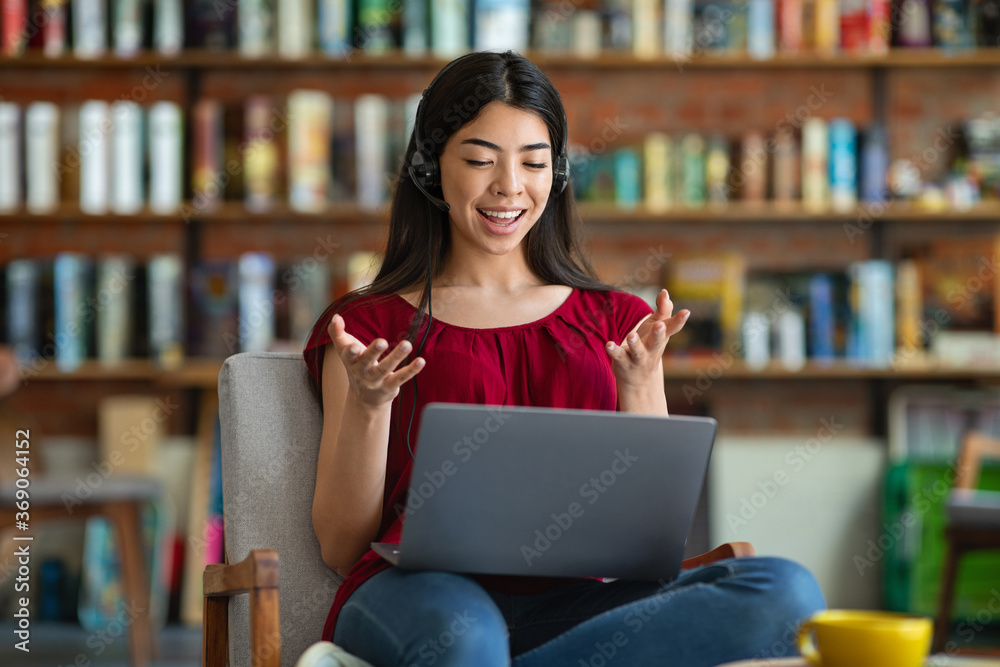 Online Tutoring. Young Asian Female Tutor Teaching Foreign Language Via Video Conference Online Tutoring. Young Asian Female Tutor Teaching Foreign Language Via Video Conference