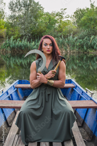 Young woman in a green dress in a boat © ivana