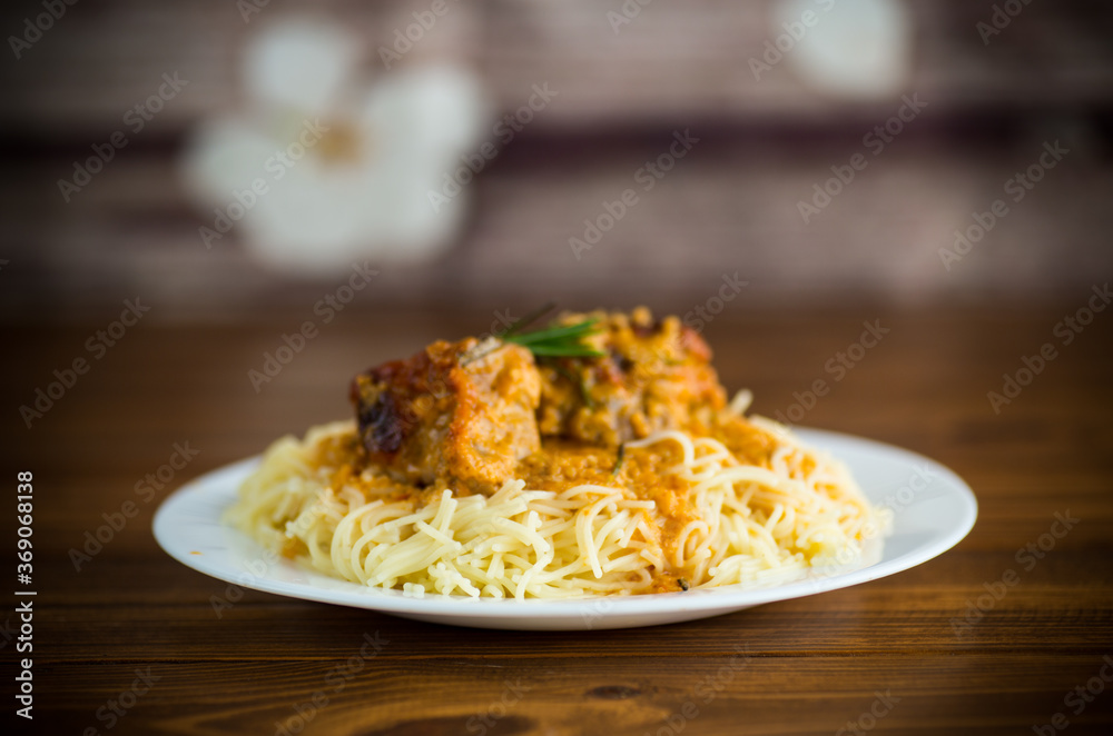 boiled vermicelli with meat and gravy in a plate boiled vermicelli with meat and gravy in a plate