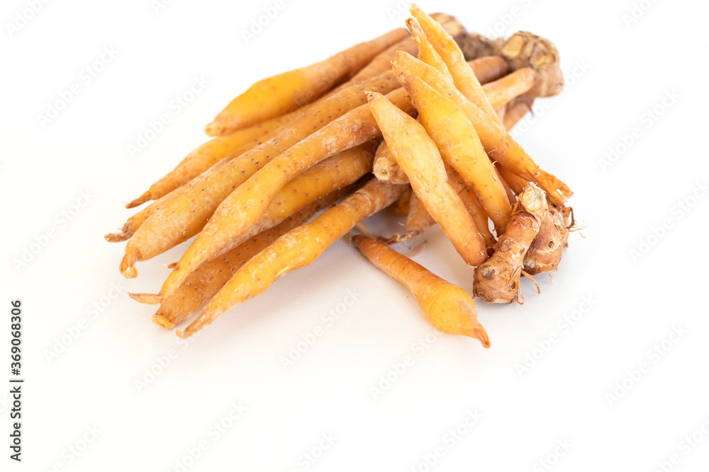 close up of Krachai or finger root an ingredient for seasoning and aromatic for Thai cooking, isolated on white background with copy space for text. close up of Krachai or finger root an ingredient for seasoning and aromatic for Thai cooking, isolated on white background with copy space for text.