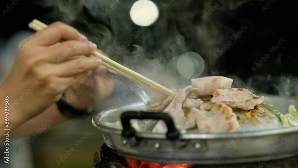 Pork roast on the stove at night. Thai food Pork roast on the stove at night. Thai food