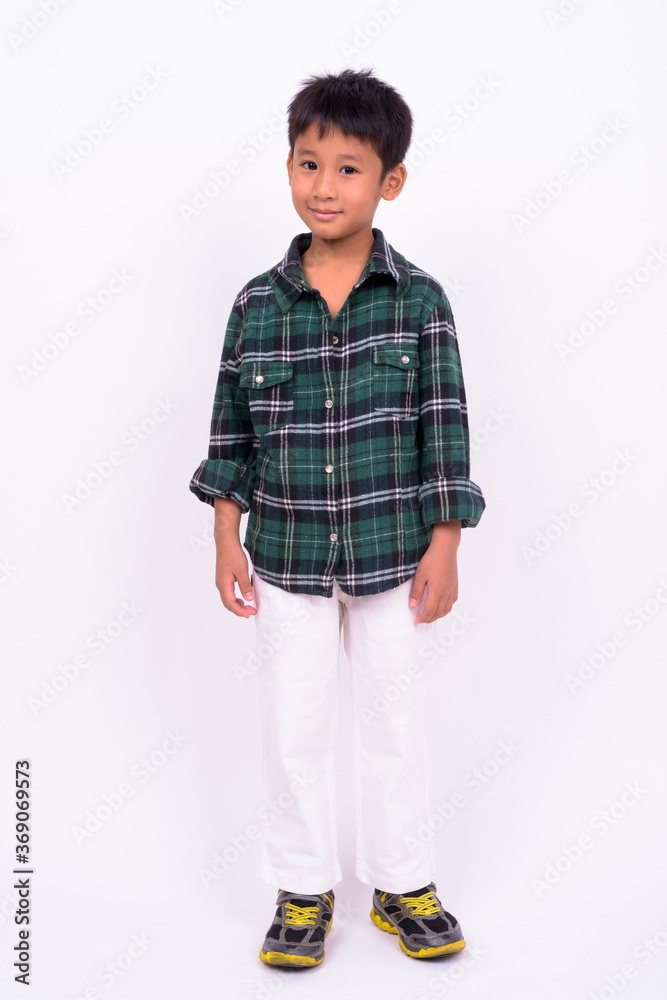 Studio shot of cute Asian boy against white background Studio shot of cute Asian boy against white background