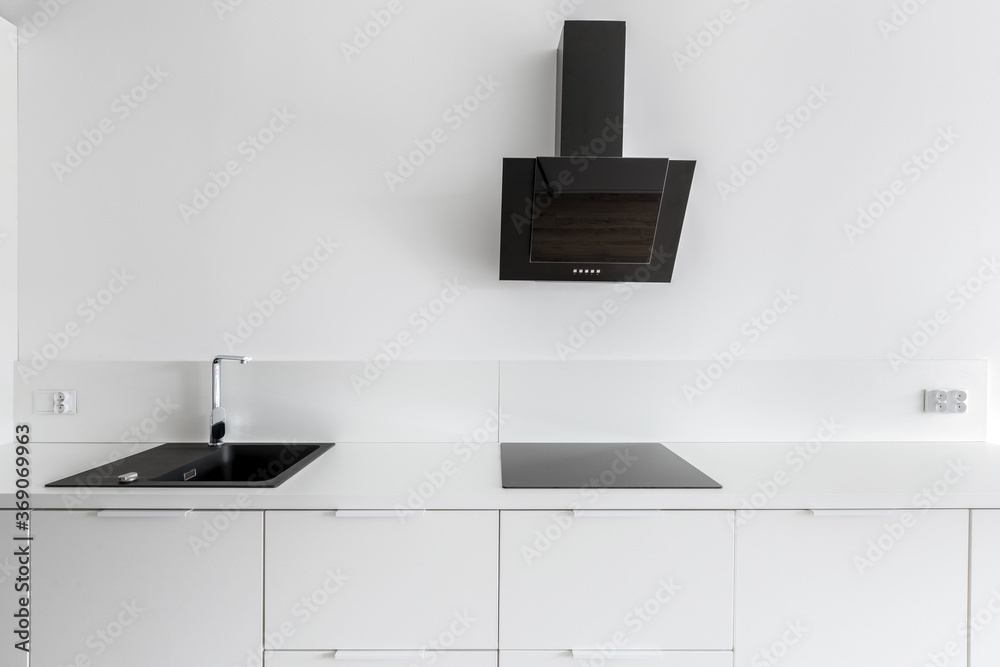 White kitchen with black accents White kitchen with black accents