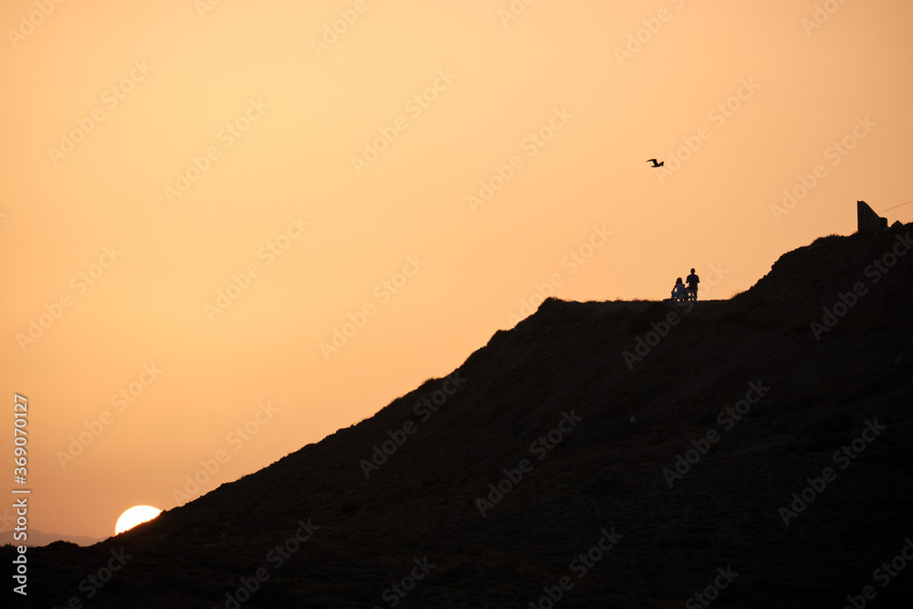 silhouette of a couple during the sunset in Cabo de Gata, Almeria silhouette of a couple during the sunset in Cabo de Gata, Almeria