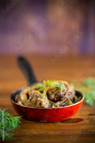 Beef liver fried with onions and herbs