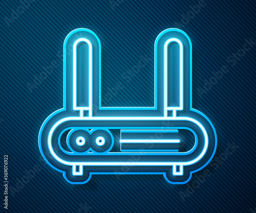 Glowing neon line Router and wi-fi signal icon isolated on blue background. Wireless ethernet modem router. Computer technology internet. Vector Illustration.